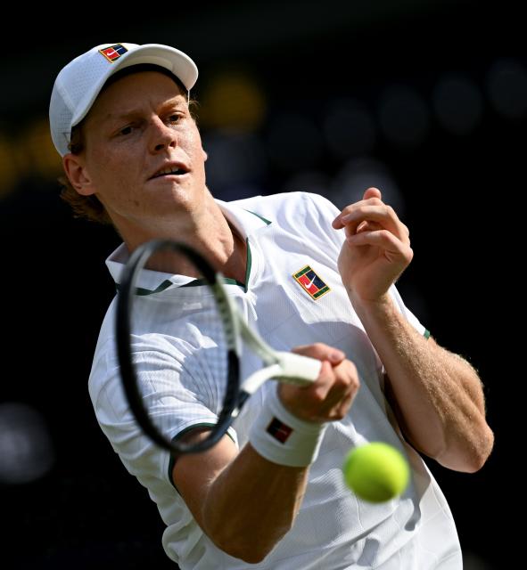 (260711) -- LONDON, July 11, 2026 (Xinhua) -- Jannik Sinner hits a return during the men's singles semifinal between Jannik Sinner of Italy and Novak Djokovic of Serbia at the Wimbledon Tennis Championships in London, Britain, on July 10, 2026. (Xinhua/Li Ying)