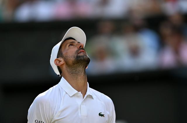 (260711) -- LONDON, July 11, 2026 (Xinhua) -- Novak Djokovic reacts during the men's singles semifinal between Jannik Sinner of Italy and Novak Djokovic of Serbia at the Wimbledon Tennis Championships in London, Britain, on July 10, 2026. (Xinhua/Li Ying)