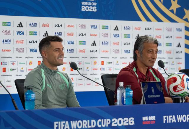 (260711) -- KANSAS CITY, July 11, 2026 (Xinhua) -- Switzerland's head coach Murat Yakin (R) and player Granit Xhaka attend a press conference ahead of the quarterfinal between Argentina and Switzerland at the 2026 FIFA World Cup in Kansas City, the United States, on July 10, 2026. (Xinhua/Xiao Yijiu)