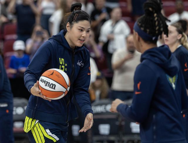 (260711) -- MONTREAL, July 11, 2026 (Xinhua) -- Li Yueru (L) of Dallas Wings warms up before the 2026 WNBA regular season basketball game between Toronto Tempo and Dallas Wings in Montreal, Canada, on July 10, 2026. (Photo by Zou Zheng/Xinhua)