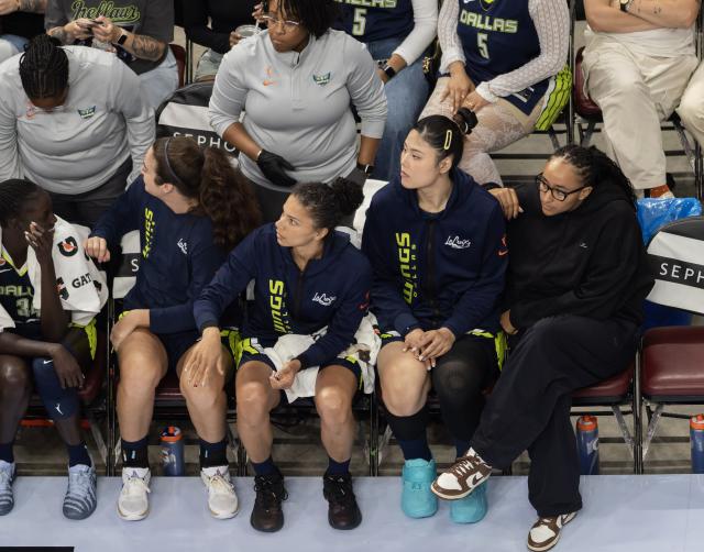 (260711) -- MONTREAL, July 11, 2026 (Xinhua) -- Li Yueru (2nd R, front) of Dallas Wings watches the game on the bench during the 2026 WNBA regular season basketball game between Toronto Tempo and Dallas Wings in Montreal, Canada, on July 10, 2026. (Photo by Zou Zheng/Xinhua)
