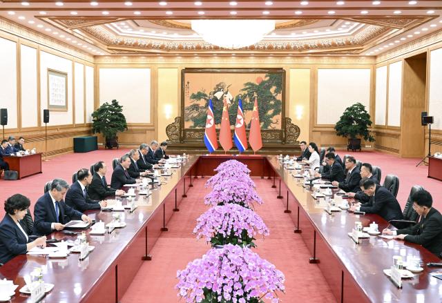 (260711) -- BEIJING, July 11, 2026 (Xinhua) -- Chinese Premier Li Qiang, also a member of the Standing Committee of the Political Bureau of the Communist Party of China (CPC) Central Committee, holds talks with Pak Thae Song, premier of the Cabinet of the Democratic People's Republic of Korea (DPRK), also a member of the Presidium of the Political Bureau of the Central Committee of the Workers' Party of Korea and vice president of the State Affairs Commission of the DPRK, at the Great Hall of the People in Beijing, capital of China, July 11, 2026. (Xinhua/Zhang Ling)