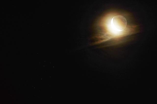 (260711) -- HARBIN, July 11, 2026 (Xinhua) -- This photo taken on July 11, 2026 shows a view of the Pleiades star cluster and a crescent moon in Tongjiang City, northeast China's Heilongjiang Province. (Photo by Liu Wanping/Xinhua)