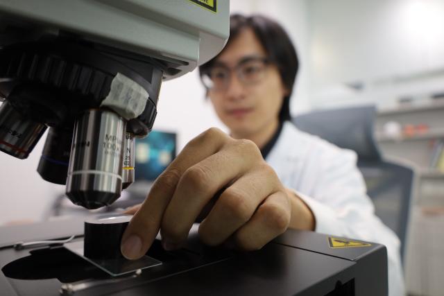 (260711) -- NANCHANG, July 11, 2026 (Xinhua) -- This file photo shows a staff member analyzing an ancient ceramic sample at Jingdezhen Imperial Kiln Institute in Jingdezhen, east China's Jiangxi Province. (Jingdezhen Imperial Kiln Institute/Handout via Xinhua)
