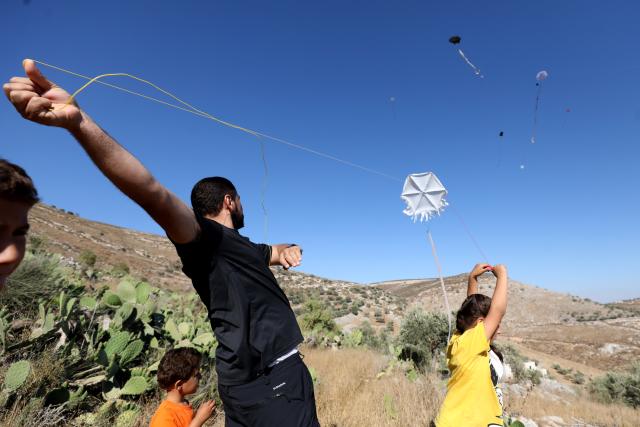 (260711) -- NABLUS, July 11, 2026 (Xinhua) -- Palestinians fly kites during a kite festival in the village of Burin, south of Nablus in the West Bank, on July 10, 2026. (Photo by Nidal Eshtayeh/Xinhua)