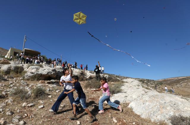 (260711) -- NABLUS, July 11, 2026 (Xinhua) -- Palestinians fly kites during a kite festival in the village of Burin, south of Nablus in the West Bank, on July 10, 2026. (Photo by Nidal Eshtayeh/Xinhua)