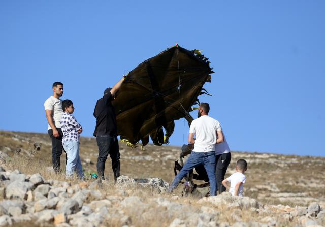 (260711) -- NABLUS, July 11, 2026 (Xinhua) -- Palestinians fly a kite during a kite festival in the village of Burin, south of Nablus in the West Bank, on July 10, 2026. (Photo by Nidal Eshtayeh/Xinhua)