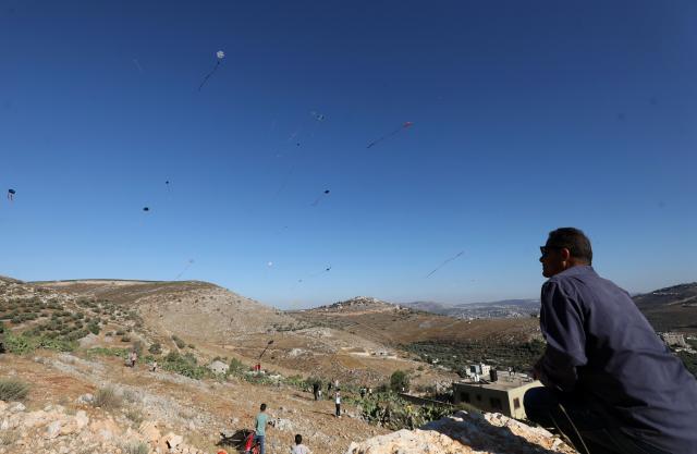 (260711) -- NABLUS, July 11, 2026 (Xinhua) -- Palestinians fly kites during a kite festival in the village of Burin, south of Nablus in the West Bank, on July 10, 2026. (Photo by Nidal Eshtayeh/Xinhua)