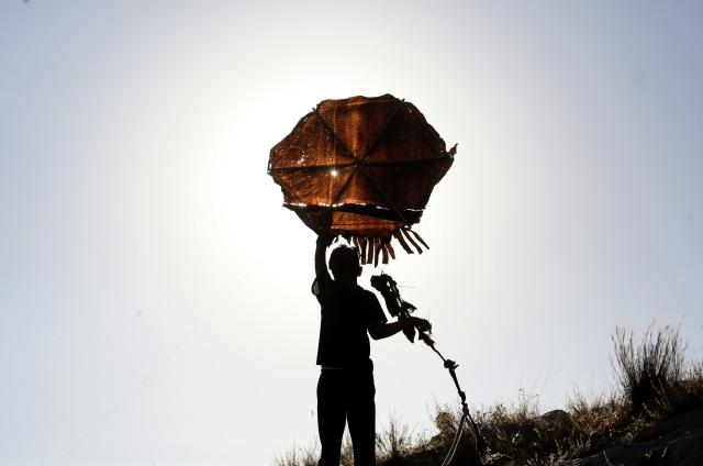 (260711) -- NABLUS, July 11, 2026 (Xinhua) -- A Palestinian flies a kite during a kite festival in the village of Burin, south of Nablus in the West Bank, on July 10, 2026. (Photo by Nidal Eshtayeh/Xinhua)