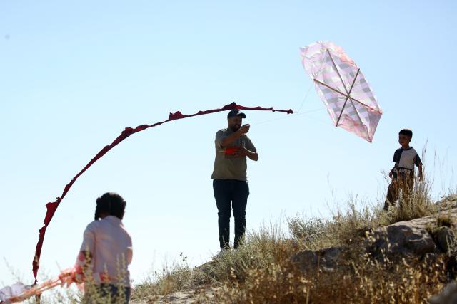 (260711) -- NABLUS, July 11, 2026 (Xinhua) -- A Palestinian flies a kite during a kite festival in the village of Burin, south of Nablus in the West Bank, on July 10, 2026. (Photo by Nidal Eshtayeh/Xinhua)