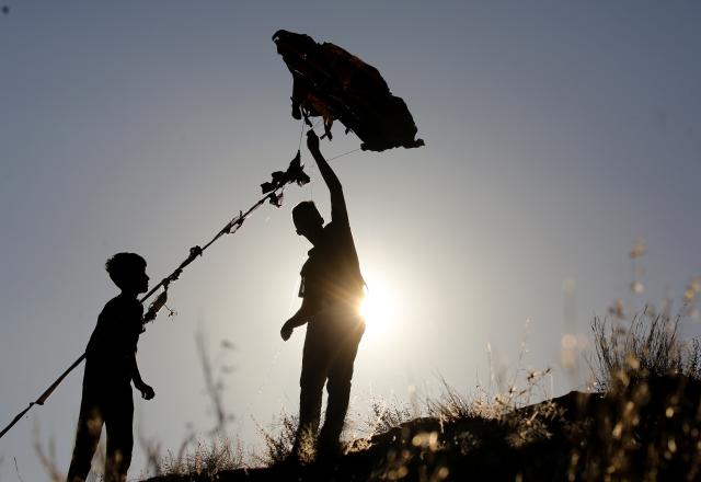 (260711) -- NABLUS, July 11, 2026 (Xinhua) -- Palestinians fly a kite during a kite festival in the village of Burin, south of Nablus in the West Bank, on July 10, 2026. (Photo by Nidal Eshtayeh/Xinhua)