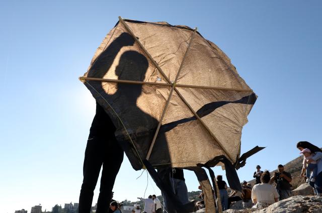 (260711) -- NABLUS, July 11, 2026 (Xinhua) -- Palestinians fly a kite during a kite festival in the village of Burin, south of Nablus in the West Bank, on July 10, 2026. (Photo by Nidal Eshtayeh/Xinhua)