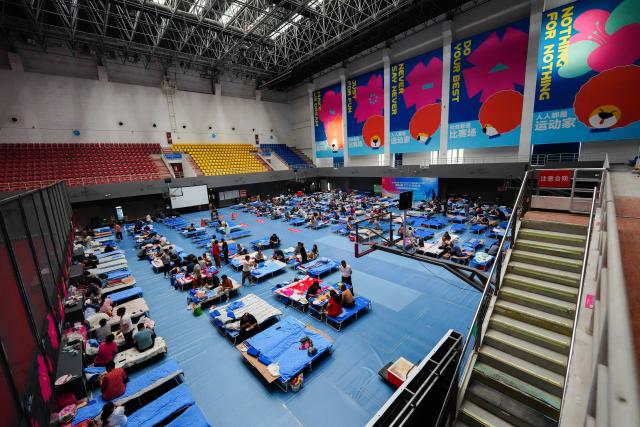 (260711) -- BEIJING, July 11, 2026 (Xinhua) -- This photo taken on July 11, 2026 shows a temporary shelter in the district sports center at Pinggu District in Beijing, capital of China.
  Beijing is still under a Level II flood control emergency response as continuous heavy rainfall lashes the city, with eight of its districts activating the highest level flood response. As of Saturday morning, the city had evacuated 104,042 residents, shut down 181 tourist attractions and 4,311 rural homestays, with 27,418 rescue workers on standby to handle disasters such as mountain floods and landslides. (Xinhua/Xie Han)