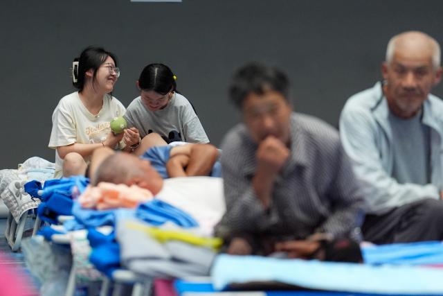 (260711) -- BEIJING, July 11, 2026 (Xinhua) -- People are pictured at a temporary shelter in Pinggu District in Beijing, capital of China, July 11, 2026.
  Beijing is still under a Level II flood control emergency response as continuous heavy rainfall lashes the city, with eight of its districts activating the highest level flood response. As of Saturday morning, the city had evacuated 104,042 residents, shut down 181 tourist attractions and 4,311 rural homestays, with 27,418 rescue workers on standby to handle disasters such as mountain floods and landslides. (Xinhua/Xie Han)