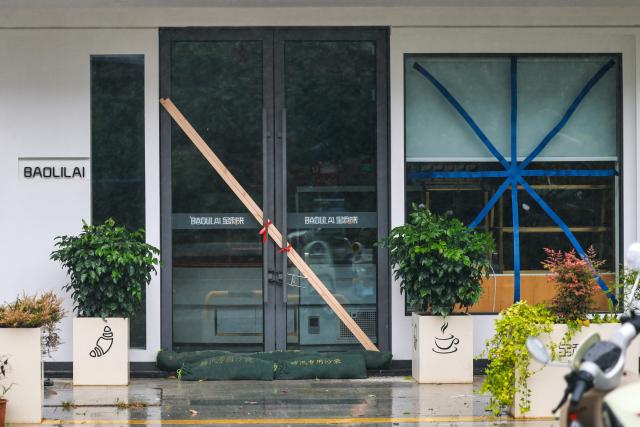 (260711) -- WENZHOU, July 11, 2026 (Xinhua) -- This photo taken on July 11, 2026 shows the doors and windows of a closed store, reinforced with windproof measures, in Yueqing of Wenzhou, east China's Zhejiang Province. Zhejiang Province in east China raised its typhoon emergency response to the highest level on Saturday as Typhoon Bavi, the 9th typhoon of 2026, barrels toward the country's eastern coast, triggering widespread disaster prevention efforts across multiple provincial-level regions. 
  According to Zhejiang Meteorological Observatory, the severe typhoon was located some 489 km off the coast of the province's city of Wenzhou as of 9 a.m. on Saturday, packing strong-typhoon-level winds near its center. It is forecast to move northwest at a speed of 30 to 35 km per hour and make landfall in Zhejiang around midnight. (Xinhua/Jiang Han)
