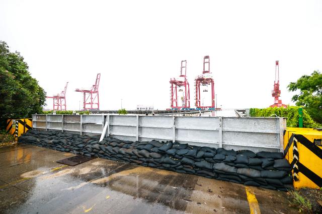 (260711) -- WENZHOU, July 11, 2026 (Xinhua) -- This photo taken on July 11, 2026 shows a sealing and reinforcement site at a container wharf in Yueqing of Wenzhou, east China's Zhejiang Province. Zhejiang Province in east China raised its typhoon emergency response to the highest level on Saturday as Typhoon Bavi, the 9th typhoon of 2026, barrels toward the country's eastern coast, triggering widespread disaster prevention efforts across multiple provincial-level regions. 
  According to Zhejiang Meteorological Observatory, the severe typhoon was located some 489 km off the coast of the province's city of Wenzhou as of 9 a.m. on Saturday, packing strong-typhoon-level winds near its center. It is forecast to move northwest at a speed of 30 to 35 km per hour and make landfall in Zhejiang around midnight. (Xinhua/Jiang Han)