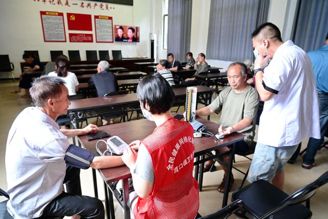 (260711) -- BEIJING, July 11, 2026 (Xinhua) -- Medical workers provide healthcare services to residents at a shelter at Jinshan Village in Nanping City, southeast China's Fujian Province, on July 11, 2026. Chinese authorities on Saturday intensified emergency response measures with Typhoon Bavi set to slam into the country's eastern coast, resulting in meteorological, water resources, transport and emergency management authorities issuing alerts and reinforcing flood-control efforts ahead of the expected landfall.
   The country's State Flood Control and Drought Relief Headquarters activated a Level-IV emergency response for flood and typhoon control in Shanghai, Jiangsu, Anhui and Jiangxi, all in east China, as well as southwest China's Sichuan Province, according to the Ministry of Emergency Management. (Xinhua/Lin Shanchuan)