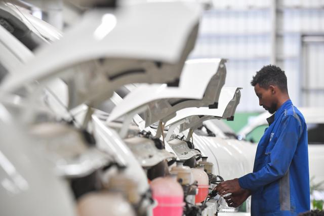 (260713) -- ADDIS ABABA, July 13, 2026 (Xinhua) -- A worker assembles an electric minibus at a factory in Addis Ababa, capital of Ethiopia, March 6, 2024.
  TO GO WITH XINHUA HEADLINES ON JULY 13, 2026. (Photo by Michael Tewelde/Xinhua)