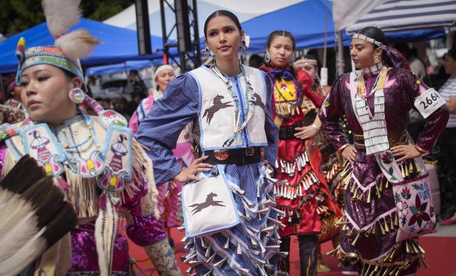 (260713) -- NORTH VANCOUVER, July 13, 2026 (Xinhua) -- Members of Indigenous communities perform during the Squamish Nation Youth Pow-Wow in North Vancouver, British Columbia, Canada, on July 12, 2026. The annual event brought together Indigenous youth, dancers, drummers and community members to celebrate First Nations cultures, traditions and heritage through traditional songs, dances and ceremonies. (Photo by Liang Sen/ Xinhua)