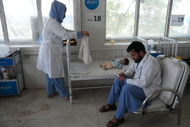 (260713) -- KABUL, July 13, 2026 (Xinhua) -- Doctors check on a malnourished child at the Indira Gandhi Institute of Child Health in Kabul, Afghanistan, July 13, 2026. The UN Children's Fund (UNICEF) has raised the alarm that 3.7 million children under the age of 5 in Afghanistan are at heightened risk of malnutrition, according to a new report issued on Sunday. (Photo by Saifurahman Safi/Xinhua)