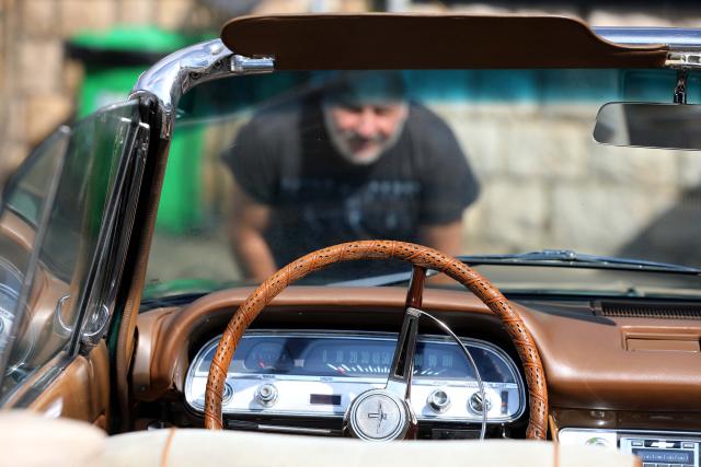 (260713) -- ALEY, July 13, 2026 (Xinhua) -- A man visits the classic cars exhibition in Aley, Lebanon, July 12, 2026. (Xinhua/Bilal Jawich)