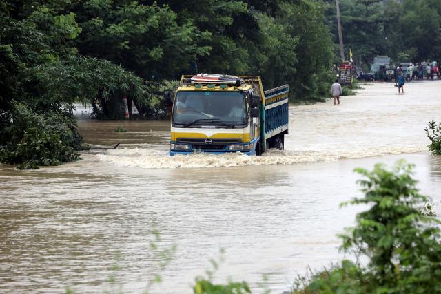 (260713) -- COX'S BAZAR, July 13, 2026 (Xinhua) -- A truck drives in floodwater in Cox's Bazar district, Bangladesh, July 12, 2026. Floods that have swept parts of Bangladesh for about a week have killed 51 people, said a senior official on Sunday.
   According to the latest daily disaster situation report released by the country's Ministry of Disaster Management and Relief, more than 1.02 million people were marooned by floods in seven out of the country's total 64 districts. (Photo by Habibur Rahman/Xinhua)