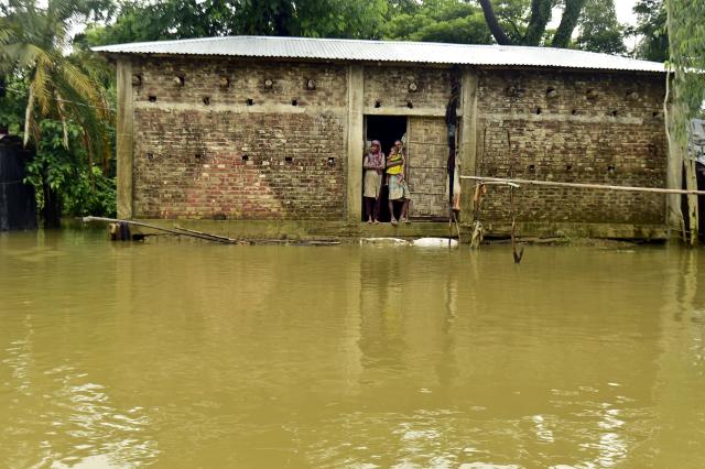 (260713) -- COX'S BAZAR, July 13, 2026 (Xinhua) -- People are marooned by floodwater in Cox's Bazar district, Bangladesh, July 12, 2026. Floods that have swept parts of Bangladesh for about a week have killed 51 people, said a senior official on Sunday.
   According to the latest daily disaster situation report released by the country's Ministry of Disaster Management and Relief, more than 1.02 million people were marooned by floods in seven out of the country's total 64 districts. (Photo by Habibur Rahman/Xinhua)