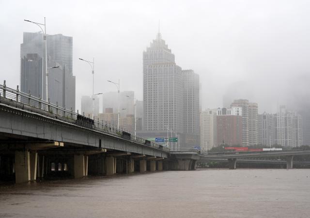 (260713) -- SHENYANG, July 13, 2026 (Xinhua) -- This photo taken on July 13, 2026 shows the swollen Hunhe River in Shenyang, northeast China's Liaoning Province. Due to recent downpours, the water level at the Shenyang Hydrological Station on the Hunhe River reached 37.99 meters. (Xinhua/Li Gang)