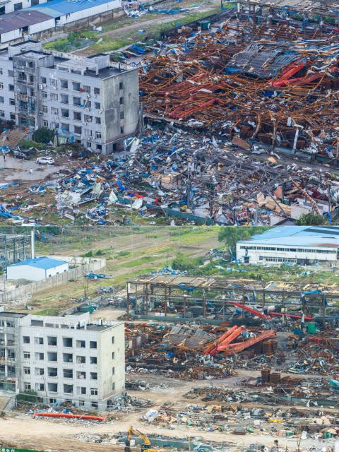 (260713) -- HUANGGANG, July 13, 2026 (Xinhua) -- This drone combo photo shows a place near a logistic park after thunderstorms and gales in Huangzhou District of Huanggang City, central China's Hubei Province, on July 7, 2026 (above) and the cleared one on July 12, 2026 (below).
  Between 7 p.m. and 11 p.m. on July 6, thunderstorms and strong winds hit Huangshi, Huanggang, Ezhou, and Xianning, with two townships seeing gales reaching level 13 in central China's Hubei Province. Some areas saw tornadoes, according to the local authorities. The province has launched all-out rescue and relief efforts to safeguard people's lives and property.
  China's National Development and Reform Commission has allocated 50 million yuan (about 7.34 million U.S. dollars) from the central budget to support emergency recovery efforts in Hubei Province, to restore damaged infrastructure, including roads, as well as public service facilities such as schools, helping affected areas resume normal production and daily life as soon as possible. (Xinhua/Wu Zhizun)