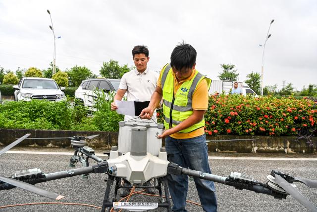 (260713) -- NANNING, July 13, 2026 (Xinhua) -- Rescue workers replace battery packs for a drone in Guigang City, south China's Guangxi Zhuang Autonomous Region, July 8, 2026. Triggered by Typhoon Maysak, heavy downpours battered multiple areas in south China's Guangxi Zhuang Autonomous Region.
   Rescue operation is underway in Guangxi, with rescuers from different parts of the country actively involved in the disaster rescue and relief efforts. (Xinhua/Cao Yiming)