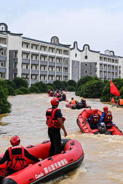 (260713) -- NANNING, July 13, 2026 (Xinhua) -- Rescuers from various provincial regions of China are pictured in an evacuation operation in Guigang City, south China's Guangxi Zhuang Autonomous Region, July 9, 2026. Triggered by Typhoon Maysak, heavy downpours battered multiple areas in south China's Guangxi Zhuang Autonomous Region.
   Rescue operation is underway in Guangxi, with rescuers from different parts of the country actively involved in the disaster rescue and relief efforts. (Xinhua/Cao Yiming)