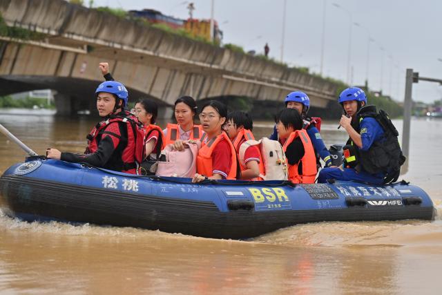 (260713) -- NANNING, July 13, 2026 (Xinhua) -- Rescuers from Guizhou Province evacuate stranded teachers and students at Xijiang education park in Guigang City, south China's Guangxi Zhuang Autonomous Region, July 8, 2026. Triggered by Typhoon Maysak, heavy downpours battered multiple areas in south China's Guangxi Zhuang Autonomous Region.
   Rescue operation is underway in Guangxi, with rescuers from different parts of the country actively involved in the disaster rescue and relief efforts. (Xinhua/Zhou Hua)