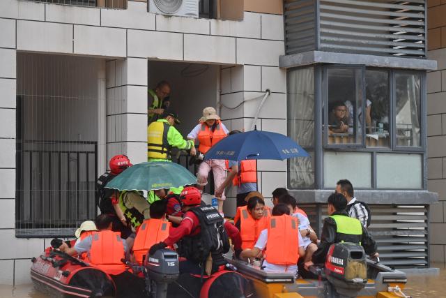 (260713) -- NANNING, July 13, 2026 (Xinhua) -- Rescuers from Guangdong Province evacuate stranded teachers and students at Xijiang education park in Guigang City, south China's Guangxi Zhuang Autonomous Region, July 8, 2026. Triggered by Typhoon Maysak, heavy downpours battered multiple areas in south China's Guangxi Zhuang Autonomous Region.
   Rescue operation is underway in Guangxi, with rescuers from different parts of the country actively involved in the disaster rescue and relief efforts. (Xinhua/Zhou Hua)