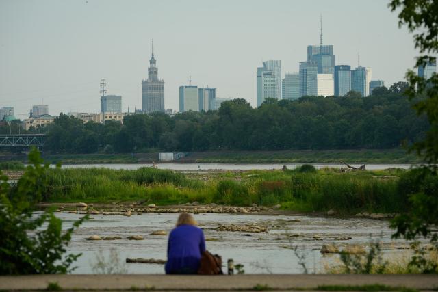 (260713) -- WARSAW, July 13, 2026 (Xinhua) -- Low water levels expose shallow areas of the Vistula River in Warsaw, Poland, July 13, 2026. Poland's longest river, the Vistula, has fallen to historically low water levels amid drought. Recent data from the Institute of Meteorology and Water Management showed that the river level at the Warsaw-Bulwary monitoring station had dropped to 19 centimeters, far below the normal level of around 230 centimeters. (Photo by Jaap Arriens/Xinhua)