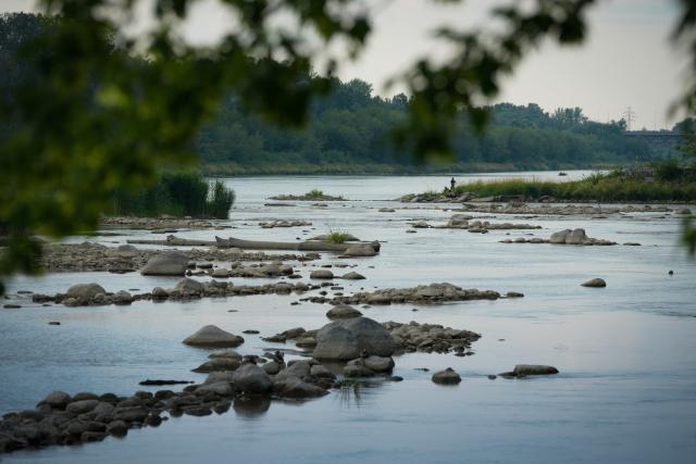 (260713) -- WARSAW, July 13, 2026 (Xinhua) -- Low water levels expose shallow areas of the Vistula River in Warsaw, Poland, July 13, 2026. Poland's longest river, the Vistula, has fallen to historically low water levels amid drought. Recent data from the Institute of Meteorology and Water Management showed that the river level at the Warsaw-Bulwary monitoring station had dropped to 19 centimeters, far below the normal level of around 230 centimeters. (Photo by Jaap Arriens/Xinhua)