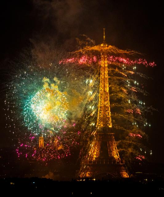 (260713) -- PARIS, July 13, 2026 (Xinhua) -- Fireworks illuminate the sky near the Eiffel Tower during the Bastille Day celebrations in Paris, France, on July 13, 2026. (Xinhua/Wu Huiwo)