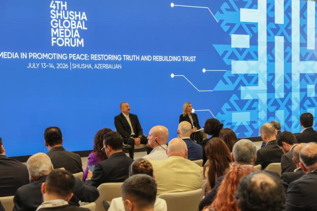 (260714) -- SHUSHA, July 14, 2026 (Xinhua) -- Azerbaijani President Ilham Aliyev (L, back) attends the 4th Shusha Global Media Forum in Shusha, Azerbaijan, July 13, 2026. (Xinhua/Chen Junfeng)