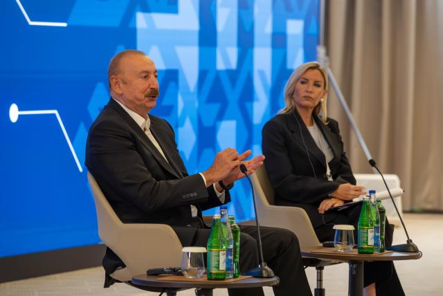 (260714) -- SHUSHA, July 14, 2026 (Xinhua) -- Azerbaijani President Ilham Aliyev (L) attends the 4th Shusha Global Media Forum in Shusha, Azerbaijan, July 13, 2026. (Xinhua/Chen Junfeng)