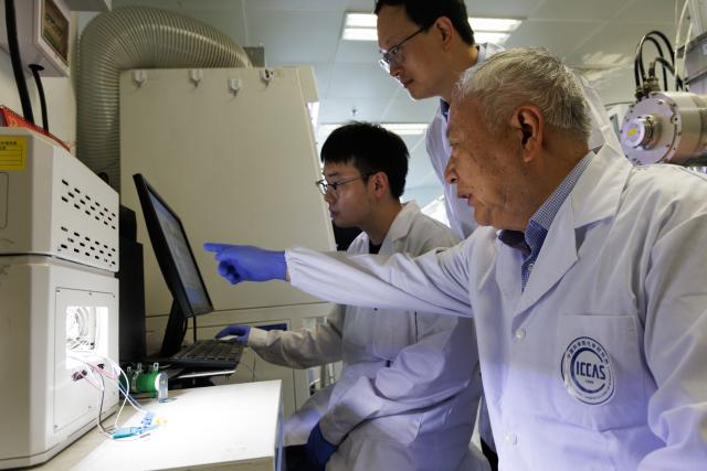 (260714) -- BEIJING, July 14, 2026 (Xinhua) -- PhD student Wu Ruihan (L), researcher Meng Lei (C) and academician Li Yongfang discuss test results of the high-performance perovskite-organic tandem solar cell at a laboratory of the Institute of Chemistry, Chinese Academy of Sciences (ICCAS), in Beijing, capital of China, July 3, 2026. A new type of solar cell developed by a team of Chinese scientists has achieved a certified steady-state power conversion efficiency of 28.04 percent, setting a new world record for this class of solar cells. 
  The team, led by Li Yongfang, an academician at the Institute of Chemistry, Chinese Academy of Sciences, and Meng Lei, a researcher from the institute, developed the high-performance perovskite-organic tandem solar cell by incorporating a photo-transformable stabilizer. The study was published online in Nature on Monday. (Xinhua/Jin Liwang)