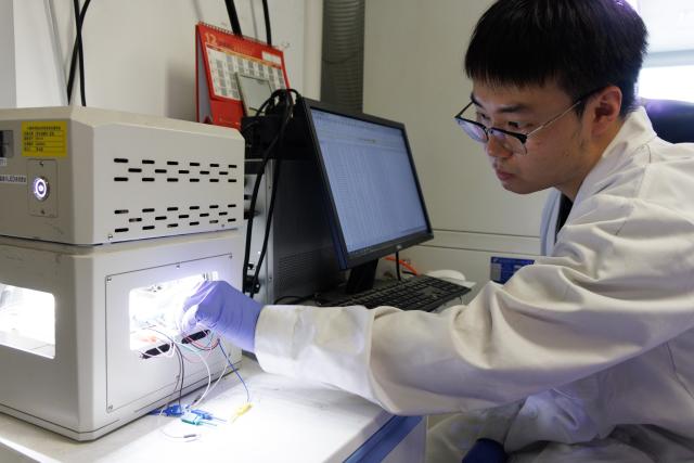 (260714) -- BEIJING, July 14, 2026 (Xinhua) -- PhD student Wu Ruihan, the first author of the research paper, tests a device of the high-performance perovskite-organic tandem solar cell at a laboratory of the Institute of Chemistry, Chinese Academy of Sciences (ICCAS), in Beijing, capital of China, July 3, 2026. A new type of solar cell developed by a team of Chinese scientists has achieved a certified steady-state power conversion efficiency of 28.04 percent, setting a new world record for this class of solar cells. 
  The team, led by Li Yongfang, an academician at the Institute of Chemistry, Chinese Academy of Sciences, and Meng Lei, a researcher from the institute, developed the high-performance perovskite-organic tandem solar cell by incorporating a photo-transformable stabilizer. The study was published online in Nature on Monday. (Xinhua/Jin Liwang)