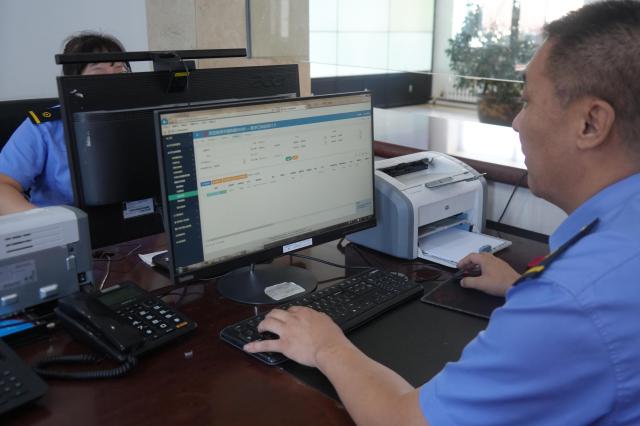 (260714) -- HARBIN, July 14, 2026 (Xinhua) -- Staff members handle customs clearance procedures for China-Europe freight trains in a digital port system at Manzhouli Station in Manzhouli, north China's Inner Mongolia Autonomous Region, on July 13, 2026. China Railway Harbin Group Co., Ltd. has advanced the development of digital port systems and railway express services while continuously improving connectivity among port infrastructure facilities. These efforts have enhanced the efficiency and capacity of the eastern corridor of the China-Europe freight train service. 
   As of June 2026, the cumulative number of China-Europe Railway Express trips via the eastern corridor had exceeded 40,000.
   The eastern corridor, consisting of three major railway ports of Manzhouli, Suifenhe and Tongjiang, has so far connected more than 60 Chinese cities with 14 European countries through 27 regular routes, serving as a vivid example of efforts to promote high-quality Belt and Road cooperation. (Photo by Huang Xu/Xinhua)