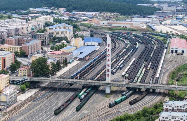 (260714) -- HARBIN, July 14, 2026 (Xinhua) -- An aerial drone photo taken on July 13, 2026 shows China-Europe freight trains waiting for transshipment at a yard of Suifenhe Station in Suifenhe, northeast China's Heilongjiang Province. China Railway Harbin Group Co., Ltd. has advanced the development of digital port systems and railway express services while continuously improving connectivity among port infrastructure facilities. These efforts have enhanced the efficiency and capacity of the eastern corridor of the China-Europe freight train service. 
   As of June 2026, the cumulative number of China-Europe Railway Express trips via the eastern corridor had exceeded 40,000.
   The eastern corridor, consisting of three major railway ports of Manzhouli, Suifenhe and Tongjiang, has so far connected more than 60 Chinese cities with 14 European countries through 27 regular routes, serving as a vivid example of efforts to promote high-quality Belt and Road cooperation. (Photo by Qu Yiwei/Xinhua)