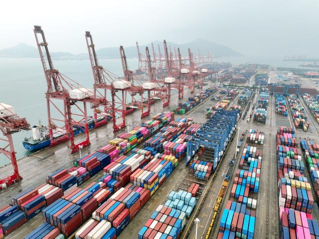 (260714) -- BEIJING, July 14, 2026 (Xinhua) -- An aerial drone photo taken on July 14, 2026 shows cargo ships loading and unloading containers at a container terminal of Lianyungang Port, east China's Jiangsu Province. China's foreign trade jumped 16.9 percent year on year in the first half of 2026 (H1) to 25.47 trillion yuan (about 3.75 trillion U.S. dollars), marking the first time the figure has exceeded 25 trillion yuan for the same period, official data showed Tuesday.
  China retains its position as the world's largest goods trader amid the robust performance, according to the data from the General Administration of Customs (GAC). (Photo by Wang Chun/Xinhua)
