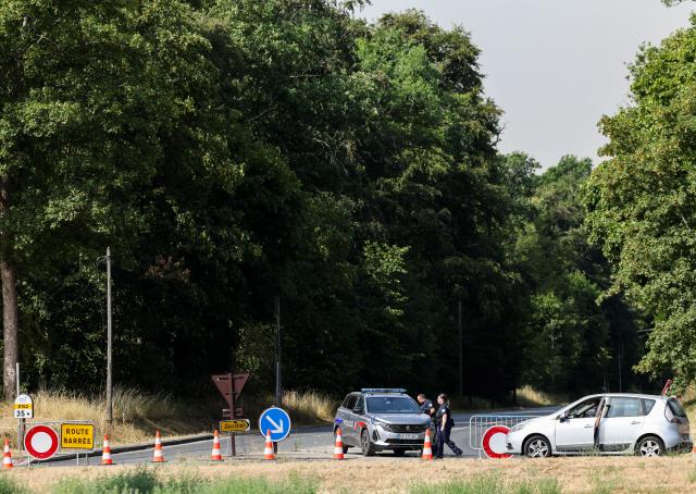 (260714) -- SEINE-ET-MARNE, July 14, 2026 (Xinhua) -- A road is closed due to a wildfire in Seine-et-Marne, France, on July 14, 2026. French police have detained 59 people across the country in connection with wildfires, including two suspects linked to the blaze in the Fontainebleau forest in Seine-et-Marne department, southeast of Paris, French Interior Minister Laurent Nunez said on Monday.
   The wildfire in the Fontainebleau forest broke out on Sunday evening and continued to spread on Monday. (Xinhua/Wu Huiwo)