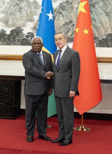 (260714) -- BEIJING, July 14, 2026 (Xinhua) -- Chinese Foreign Minister Wang Yi, also a member of the Political Bureau of the Communist Party of China Central Committee, holds talks with Rick Houenipwela, minister for foreign affairs and external trade of the Solomon Islands, in Beijing, capital of China, July 14, 2026. (Xinhua/Li Tao)