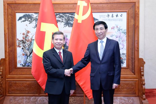 (260714) -- BEIJING, July 14, 2026 (Xinhua) -- Wang Huning, a member of the Standing Committee of the Political Bureau of the Communist Party of China Central Committee and chairman of the National Committee of the Chinese People's Political Consultative Conference, meets with a delegation of the Communist Party of Vietnam (CPV) led by Le Minh Tri, member of the Political Bureau of the CPV Central Committee and chairman of the CPV Central Committee's Commission for Internal Affairs, in Beijing, capital of China, July 14, 2026. (Xinhua/Yao Dawei)