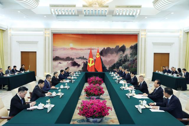 (260714) -- BEIJING, July 14, 2026 (Xinhua) -- Wang Huning, a member of the Standing Committee of the Political Bureau of the Communist Party of China Central Committee and chairman of the National Committee of the Chinese People's Political Consultative Conference, meets with a delegation of the Communist Party of Vietnam (CPV) led by Le Minh Tri, member of the Political Bureau of the CPV Central Committee and chairman of the CPV Central Committee's Commission for Internal Affairs, in Beijing, capital of China, July 14, 2026. (Xinhua/Yao Dawei)