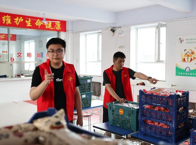 (260714) -- BEIJING, July 14, 2026 (Xinhua) -- Staff members check relief supplies at a temporary relocation in Kaiyuan, Tieling, northeast China's Liaoning Province, July 14, 2026. Torrential rain has caused flooding in multiple places in China recently. In rescue across the country, rescuers have risen to the occasion to protect the people. (Xinhua/Han He)