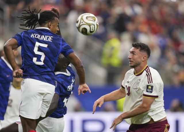 (260715) -- DALLAS, July 15, 2026 (Xinhua) -- Jules Kounde (L) of France vies with Aymeric Laporte of Spain during the semifinal match between France and Spain at the 2026 FIFA World Cup at Dallas Stadium in Dallas, the United States, July 14, 2026. (Xinhua/Wu Xiaoling)