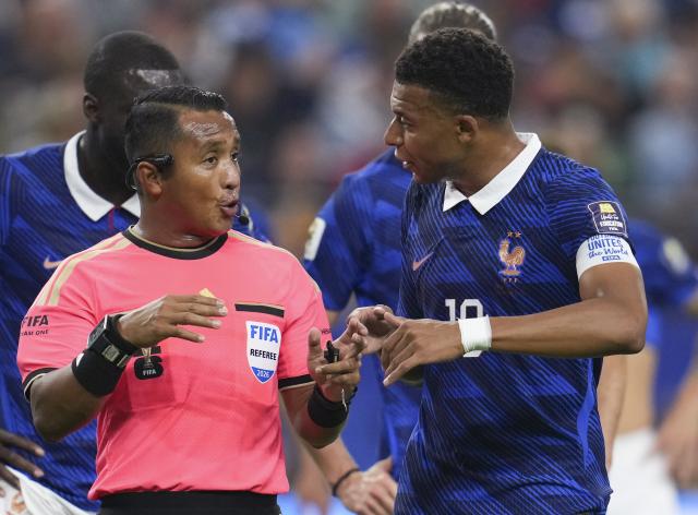 (260715) -- DALLAS, July 15, 2026 (Xinhua) -- Kylian Mbappe (R) of France communicates with referee Ivan Barton during the semifinal match between France and Spain at the 2026 FIFA World Cup at Dallas Stadium in Dallas, the United States, July 14, 2026. (Xinhua/Wu Xiaoling)